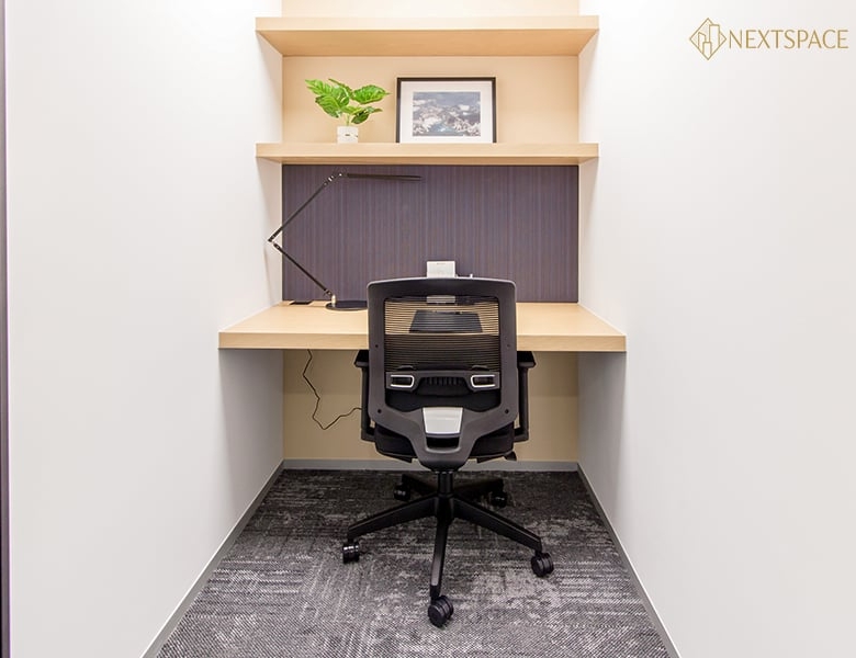 Modern office space with window blinds and cityscape in Dubai's business district.