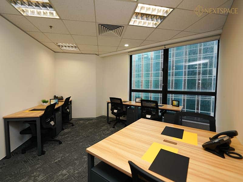 Bright office with large windows and ergonomic chairs in Dubai UAE.