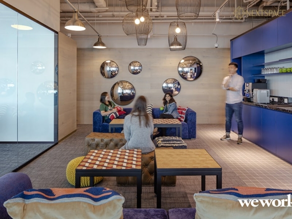 Spacious and professional office setup with collaborative workstations and private executive desks in Dubai.